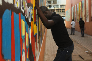 Downtown Yaoundé, Cameroon, May 2013. A young man who has been frequently beaten in his neighborhood and evicted from his home, because of his sexual orientation, and gender identity.