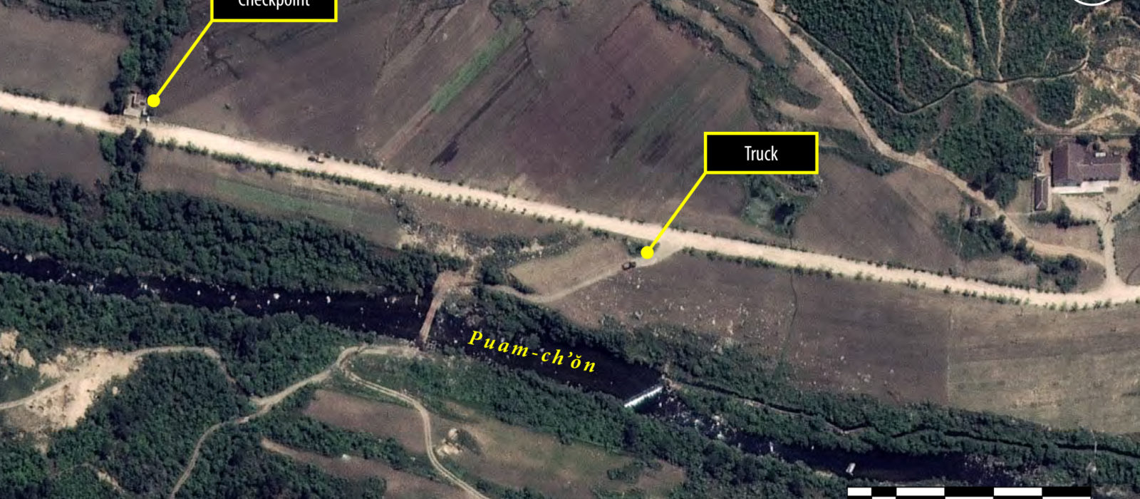 Satellite image of political prison camp Kwanliso 16, showing a checkpoint on the main road. Movement appears to be restricted within the camps.

Amnesty International commissioned analysis of satellite images of political prison camp Kwanliso 16 at Hwaseong in North Hamgyong province in October 2013. The images show that instead of heeding the growing calls for closing its political prison camps, repression by the North Korean authorities has continued and the prisoner population in kwanliso 16 appears to have slightly increased. The North Korean authorities’ on-going investment in the country’s political prison camps is part of the continuing systematic, widespread and grave violations of human rights throughout the country.