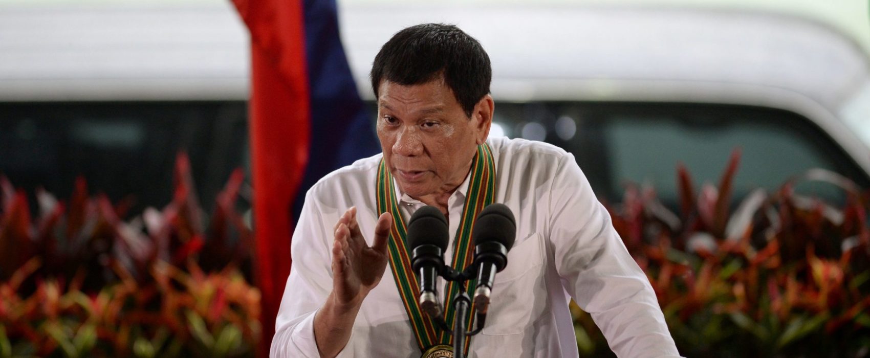 This photo taken on October 4, 2016 shows Philippine President Rodrigo Duterte gesturing as he delivers a speech during a "Talk to the Troops" visit to army personnel in Manila. 
Duterte's popularity has soared during his first three months in office, an independent survey showed on October 6, in an apparent endorsement by Filipinos of his brutal crime crackdown. / AFP / TED ALJIBE        (Photo credit should read TED ALJIBE/AFP/Getty Images)
