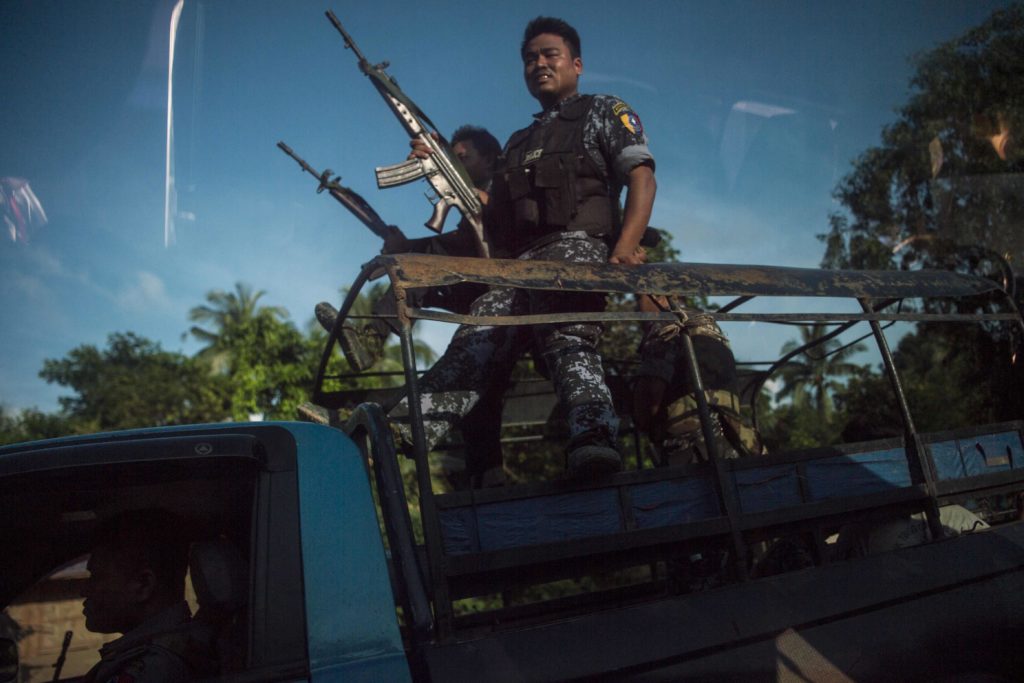 Armed military troops and police force travel in trucks through Maungdaw, located in Rakhine State, on October 14, 2016 as the government announced that terror groups were behind the series of attacks
Towns and villages across northern Rakhine state were deserted on October 14, as terrified residents fled a deadly military crackdown on foot and by air, fearing Myanmar's restive western state could once again be ripped apart by violence. / AFP / YE AUNG THU        (Photo credit should read YE AUNG THU/AFP/Getty Images)
