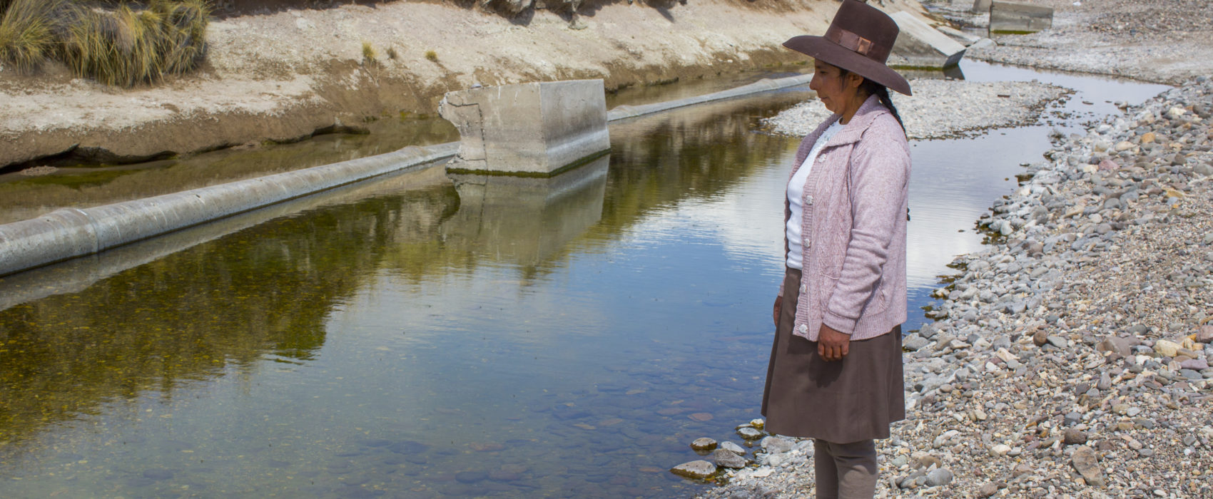 Marleny Surco looking at the water her community uses