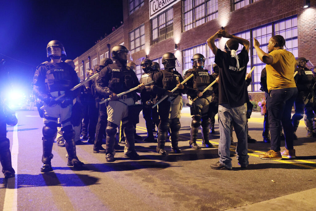 Police in riot gear force people off a street as they protest the killing of Andrew Brown Jr. on April 27, 2021 in Elizabeth City, North Carolina.
