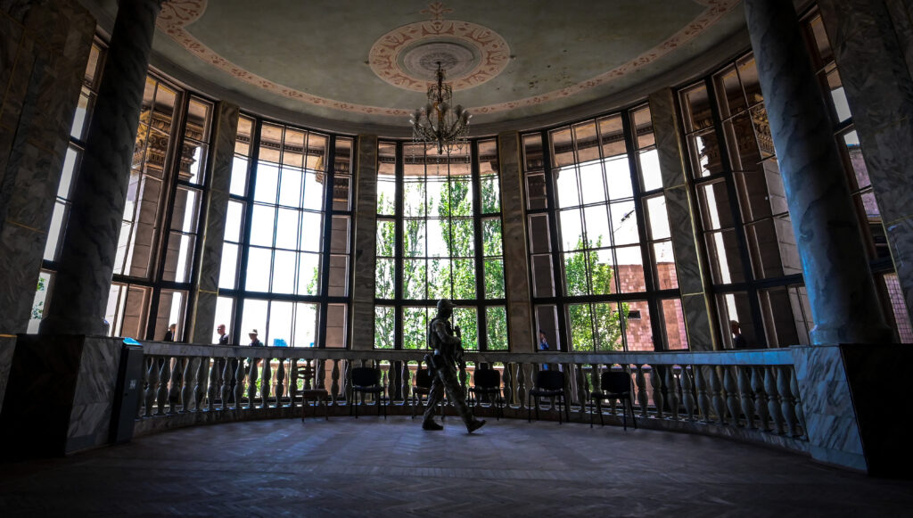 A Russian serviceman inside the Mariupol Philharmonic Hall, Ukraine, 12 June, 2022