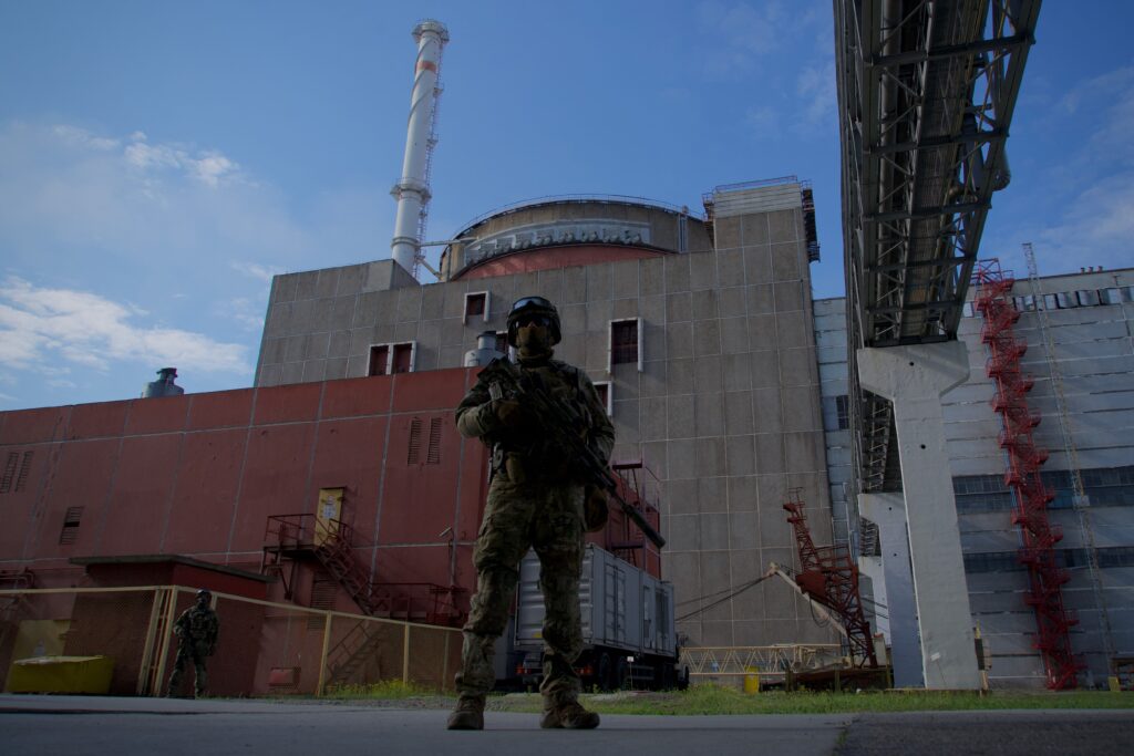 A Russian serviceman stands guard the territory outside the second reactor of the Zaporizhzhia Nuclear Power Station in Energodar on May 1, 2022