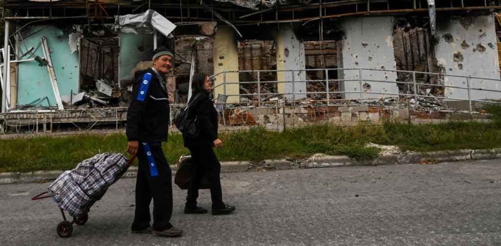 Ukraine civilians wander liberated streets