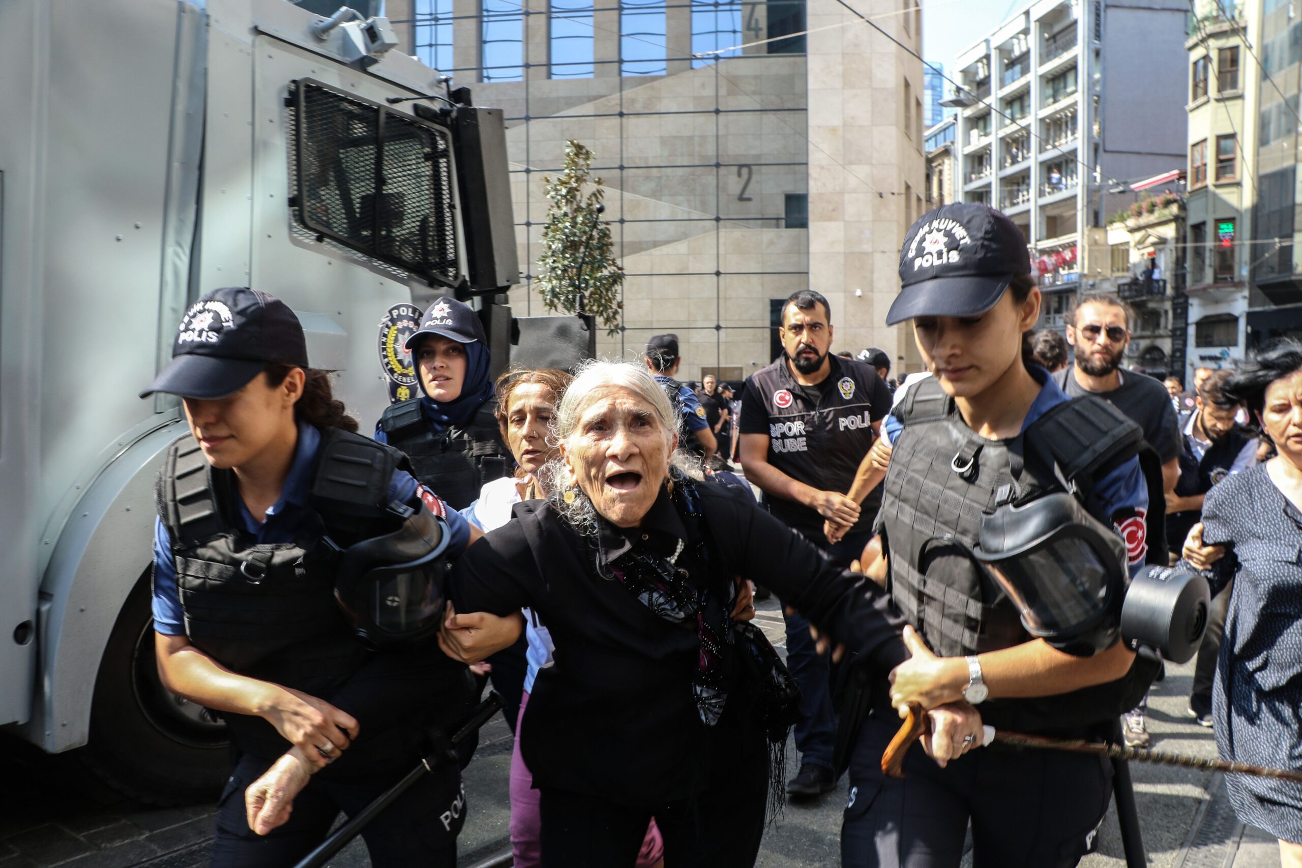 Emine Ocak, a member of Saturday Mothers Turkish group is detained by Turkish female riot police during a demonstration on August 25, 2018 in Istanbul. - Istanbul police break up a regular demonstration by Turkish mothers and other relatives of people that were forcibly disappeared in the 1980s and 1990s, detaining dozens as they marked holding the 700th such weekly protest. (Photo by Hayri TUNC / AFP) (Photo credit should read HAYRI TUNC/AFP/Getty Images) ------- The photo shows Emine Ocak, mother of Hasan Ocak, who was forcibly disappeared in the hands of the state in 1995 at age 23. The longstanding peaceful vigil known as the ‘Saturday Mothers’ vigil first started as a response to the hundreds of reported cases of enforced disappearances during the 1980s and 1990s by relatives of people who were forcibly disappeared and to protest against the prevalent impunity for grave human rights violations of the day. The exact circumstances of the disappearances in the vast majority of cases are still unknown, including the fate and whereabouts of hundreds of victims, and those responsible have not been brought to justice. Saturday Mothers have held 699 peaceful gatherings since May 1995. During this time, many participants have faced intimidation, harassment, excessive use of force, arbitrary detention and unjust prosecution. In 1999, as a result, the organizers decided to stop holding the weekly vigils, which resumed in 2009 to continue with their demand of truth and justice for all cases of enforced disappearances. On 25 August, police in Istanbul used unnecessary and excessive force, including tear gas, plastic bullets and water cannons, to disperse participants of a weekly vigil - known as the ‘Saturday Mothers vigil’ - held for victims of enforced disappearance. The longstanding protest was marking its 700th week since it was first held in 1995. Scores of participants, including elderly relatives of people who were forcibly disappeared in the hands of the state, were ill-treated and 47 people were detained before being released from police custody later that day.