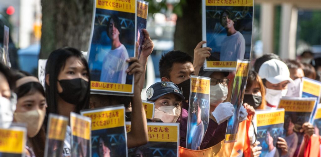 A group of activists hold placards of Japanese citizen Toru Kubota, who is detained in Myanmar, during a rally in front of the Ministry of Foreign Affairs in Tokyo on July 31, 2022.