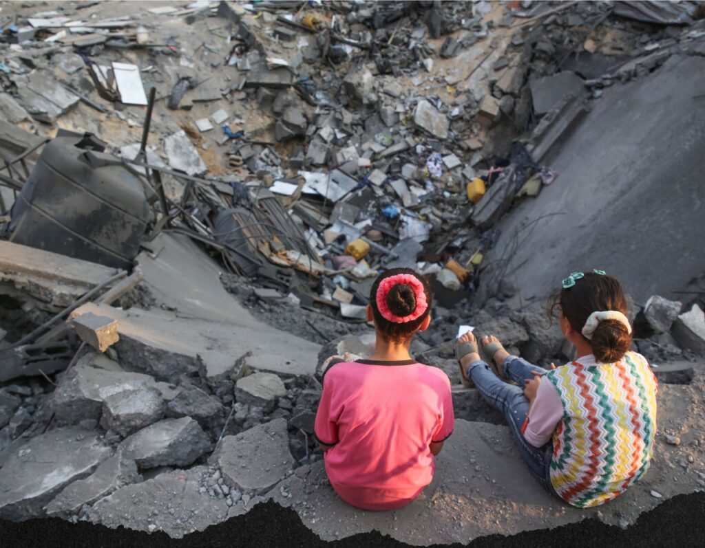 Children look on at the damage after Israel attacks on Gaza