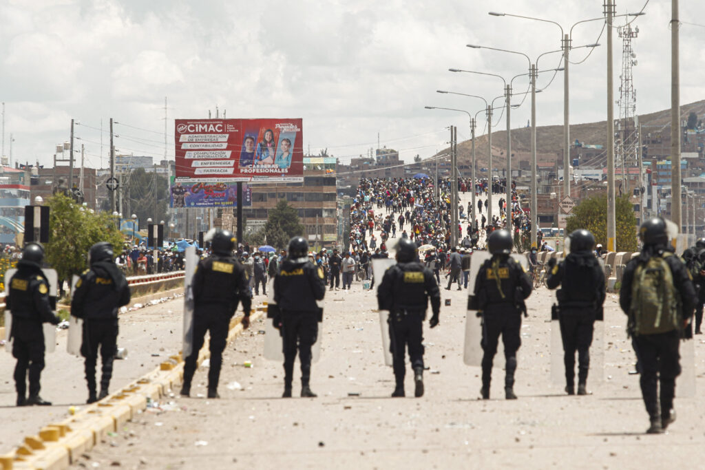 Supporters of ousted president Pedro Castillo clash with police forces in the Peruvian Andean city of Juliaca, on January 7, 2023.