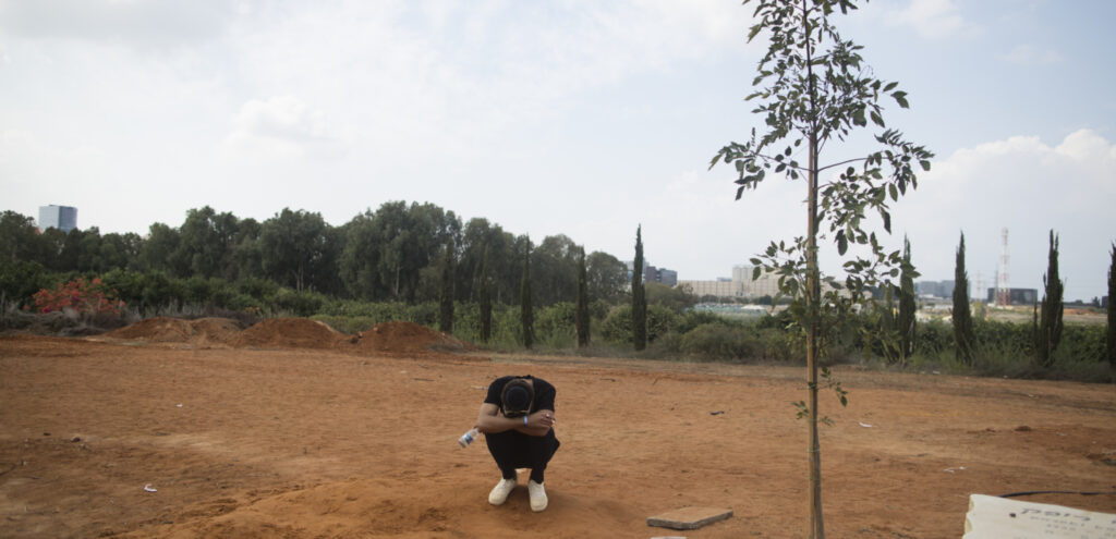 A man collapses in devastation in Gaza