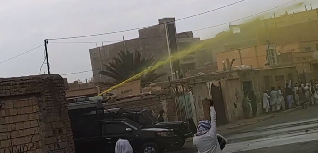 An image provided by an eyewitness on Friday 20 October 2023 shows a water cannon spraying yellow liquid to disperse Baluchi protests and facilitate subsequent arrest of marked protesters.