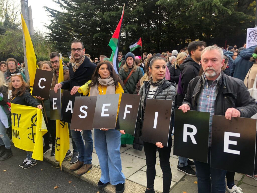 Amnesty activists call for a ceasefire now in Gaza at a solidarity rally