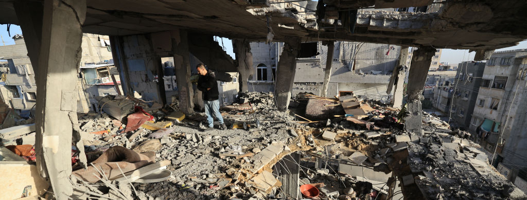 Men check the damages to the house of the Palestinian Nofal family, who were killed during Israel bombardment, on January 10, 2024 in Rafah in the southern Gaza Strip.