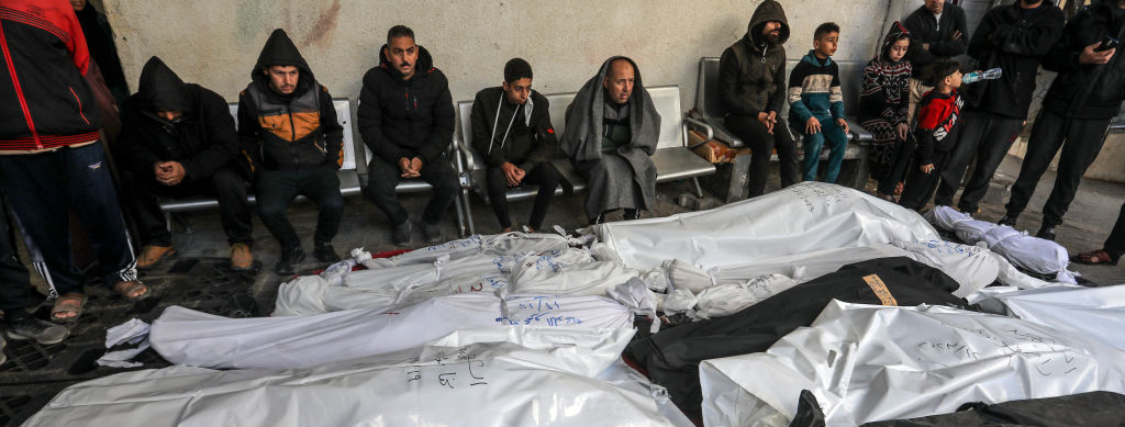 The bodies of Palestinians in bags after an Israel attack