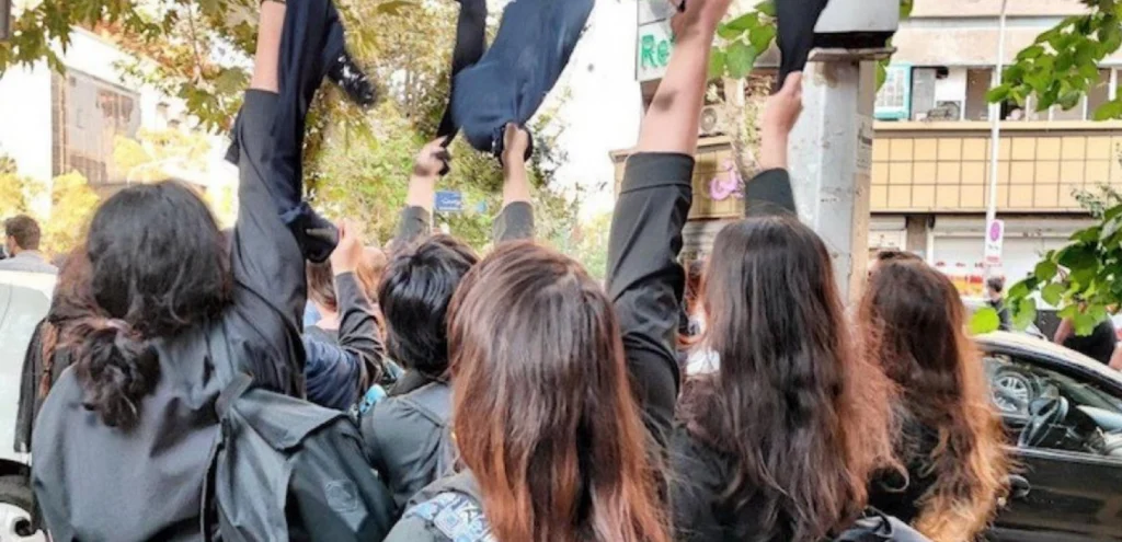 Iranian women remove headscarves. Iranian authorities are waging a large-scale campaign to enforce repressive compulsory veiling laws through widespread surveillance of women and girls in public spaces and mass police checks targeting women drivers.