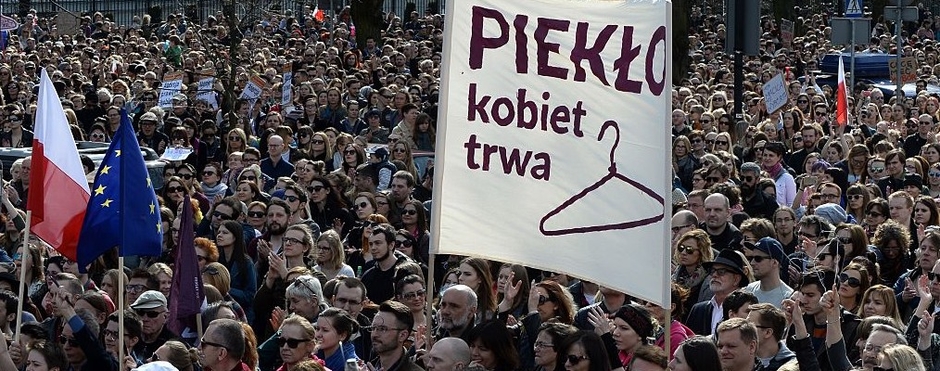 Demonstrators hold up hangers, symbolizing illegal abortion, during a protest against a possible tightening of Poland abortion law, already one of the most restrictive in Europe, in Warsaw on April 3, 2016. AFP / JANEK SKARZYNSKI (Photo credit should read JANEK SKARZYNSKI/AFP/Getty Images)